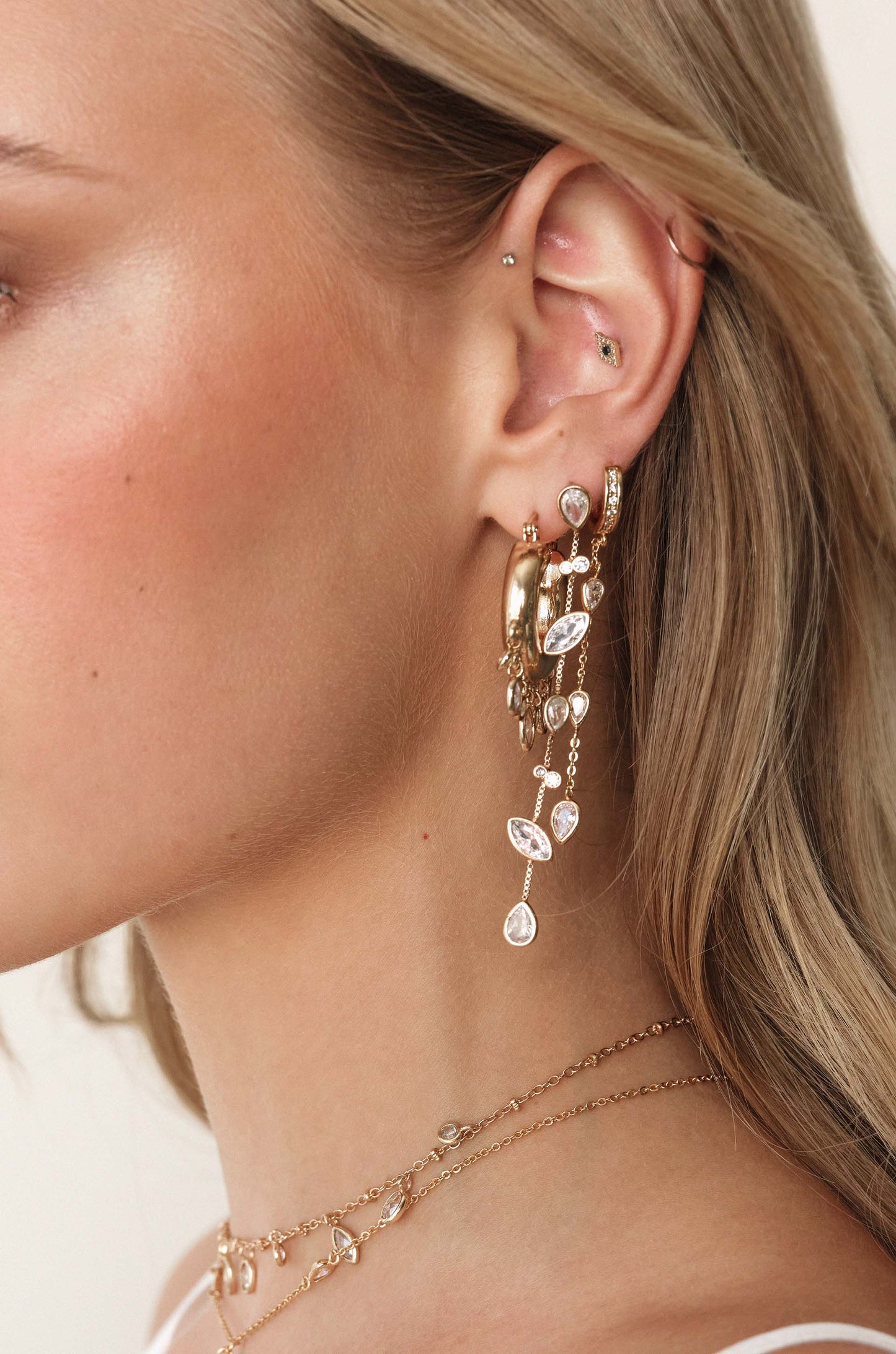 Bezel Crystal Huggie Hoop Dangle Earrings - Premium Earrings from Ettika - Just $50! Shop now at Tooksie